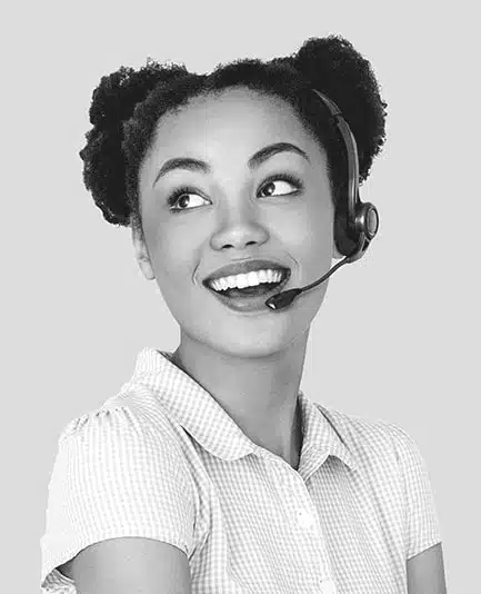 Virtual receptionist standing behind desk smiling