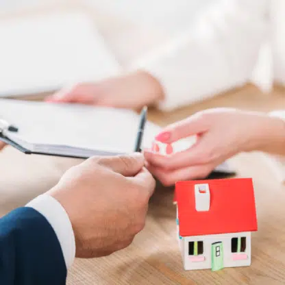 property management professionals signing paper