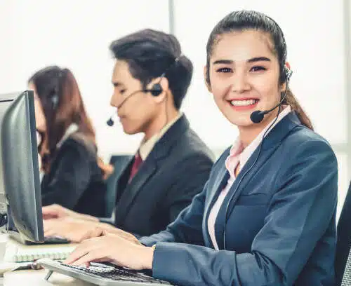 Virtual Receptionists wearing headsets working in the office to support Seasonal Businesses