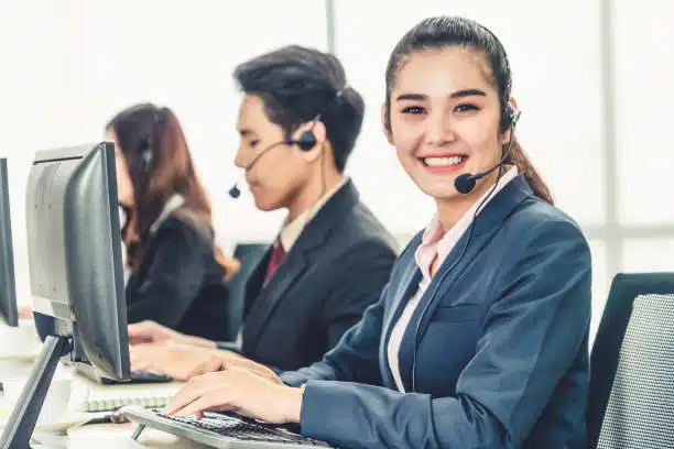 Virtual Receptionists wearing headsets working in the office to support Seasonal Businesses