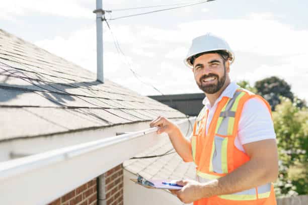 Roofing contractor roofing contractor working on his business while answering service handles calls