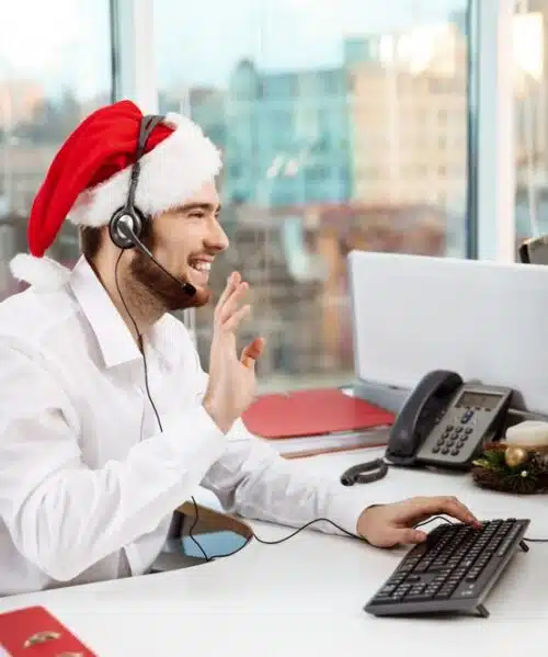 virtual receptionist calmly handling calls and providing customer support assistance over her wired microphone headset during Christmas holidays