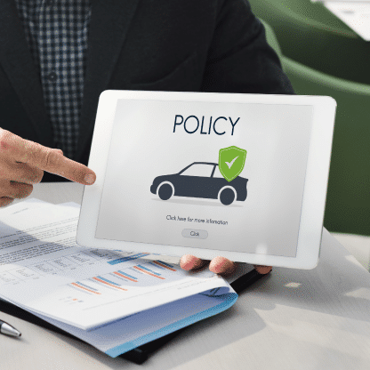 Tablet displaying auto policy info, representing an answering service for insurance agents managing client communications.