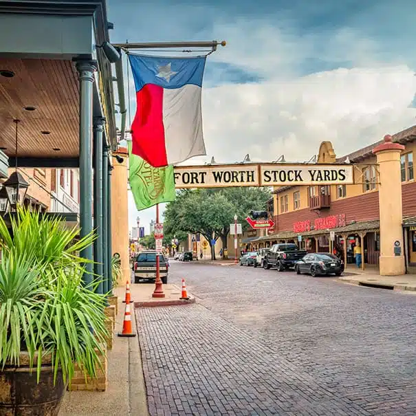Street view of Fort Worth Stock Yards with Texas flag