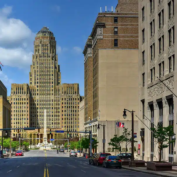 Buffalo City Hall surrounded by historic buildings on a sunny day.