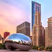 skyline featuring the Cloud Gate sculpture representing businesses served by an Illinois answering service.