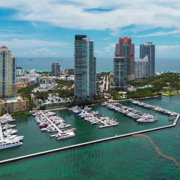 Aerial view of Miami marina and skyline, representing Posh's answering service coverage in Miami