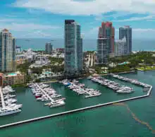 Aerial view of Miami marina and skyline, representing Posh's answering service coverage in Miami