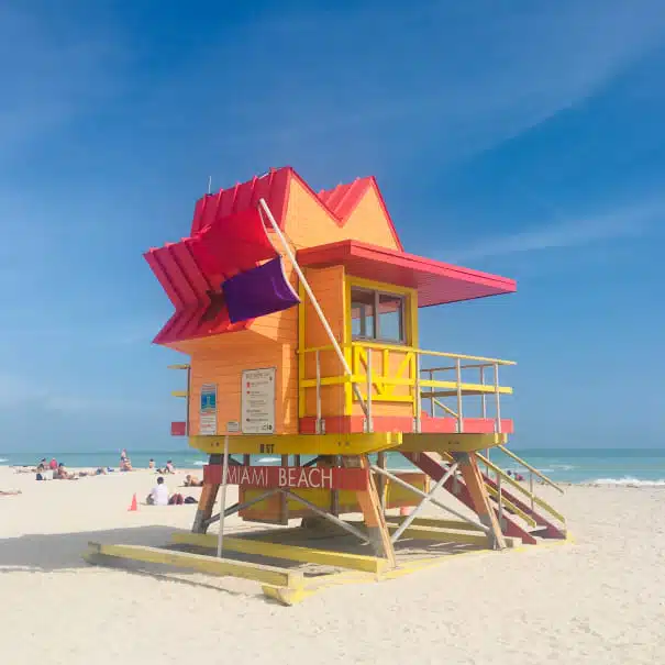 Colorful Miami Beach lifeguard tower with purple flag