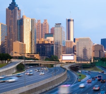 Downtown Atlanta skyline at dusk viewed from the connector highway