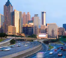 Downtown Atlanta skyline at dusk viewed from the connector highway
