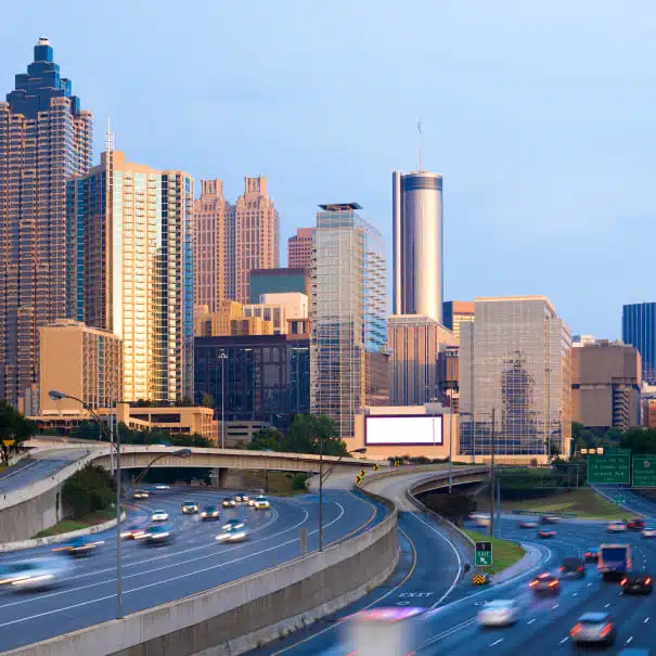 Downtown Atlanta skyline at dusk viewed from the connector highway
