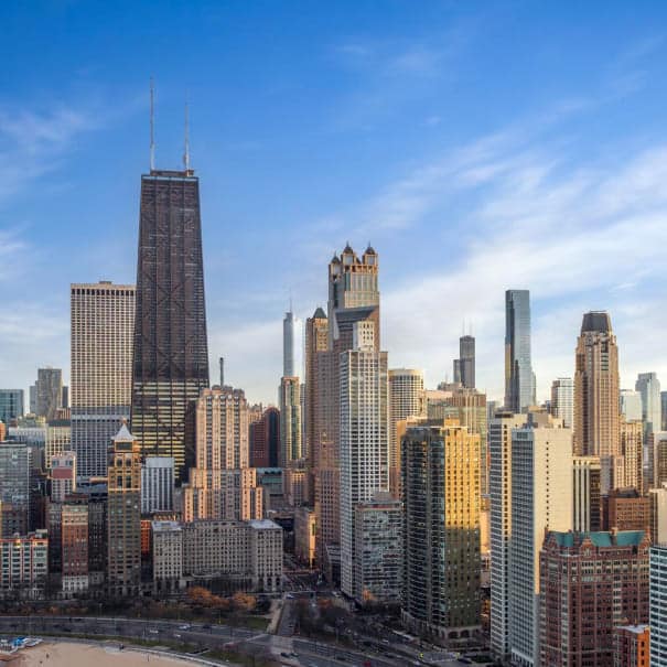 Chicago skyline and sandy lakefront beach on Lake Michigan in golden light