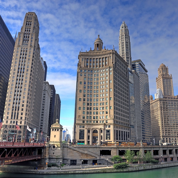 Downtown Chicago skyscrapers along the Chicago River next to a bridge